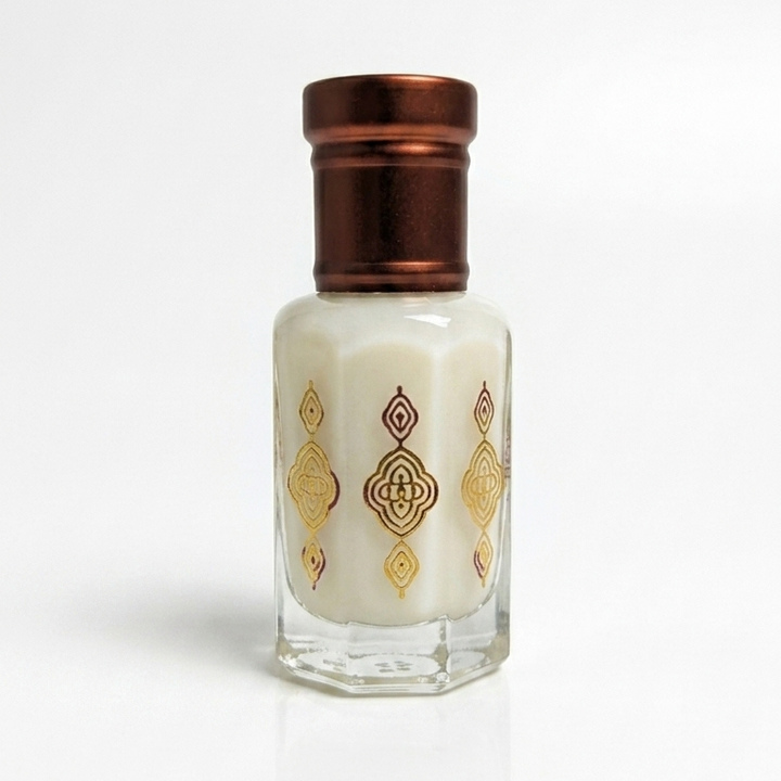 Small bottle with a decorative cap on a white background