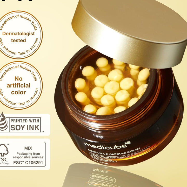 Jar of cream with capsules on a beige background, featuring 'FYI' branding and sustainability logos.