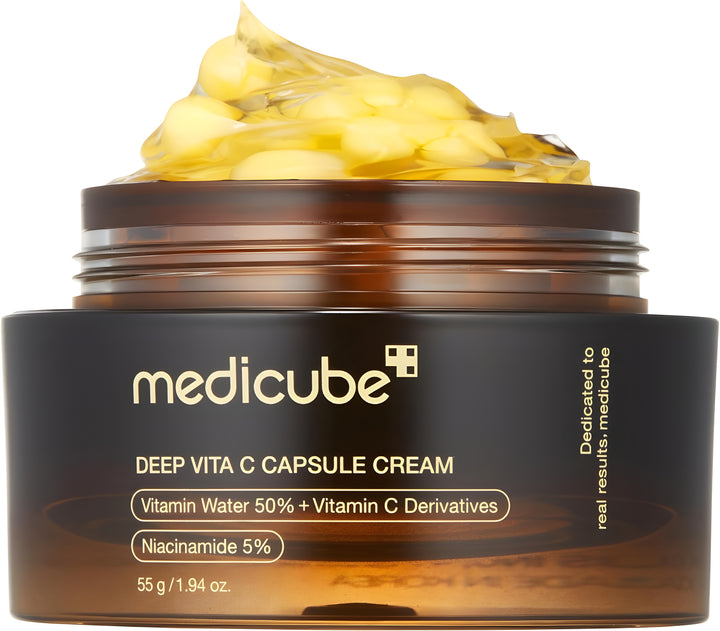 Jar of Medicube Deep Vita C Capsule Cream with yellow cream on top