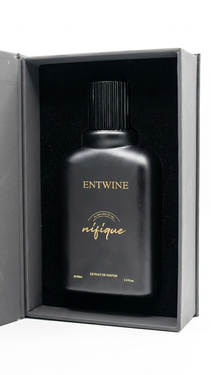 Nifique Entwine M010 Amber Oud Extrait de Parfum in a sleek matte black 100ml bottle inside a luxury presentation box.
