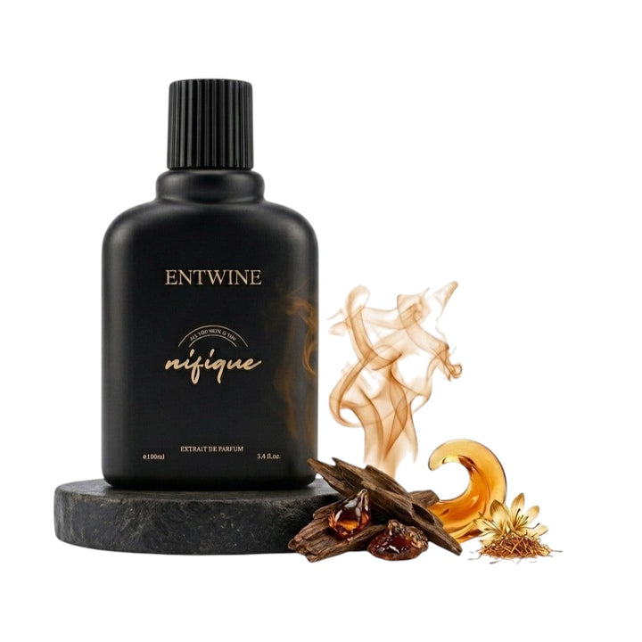Nifique Entwine M010 Amber Oud perfume bottle in matte black with saffron, amber resin, and agarwood accents.